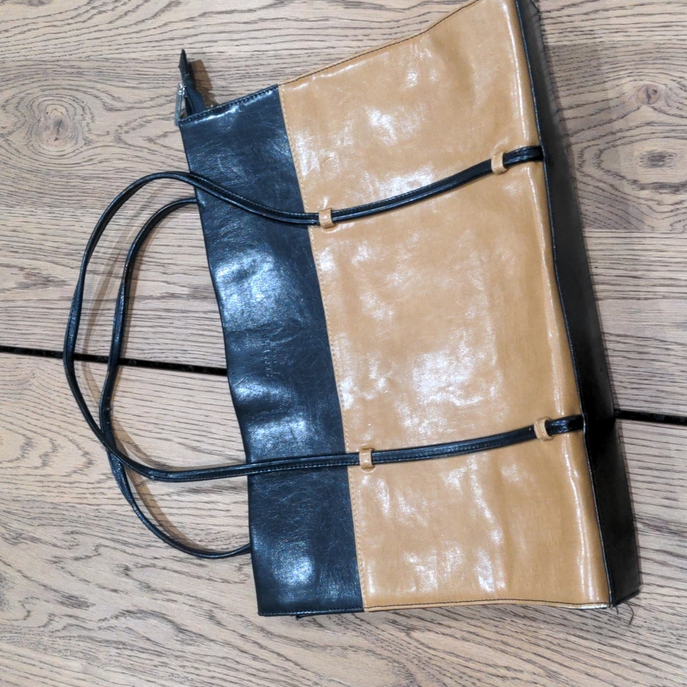 Slim profile shoulder bag with zipper closure